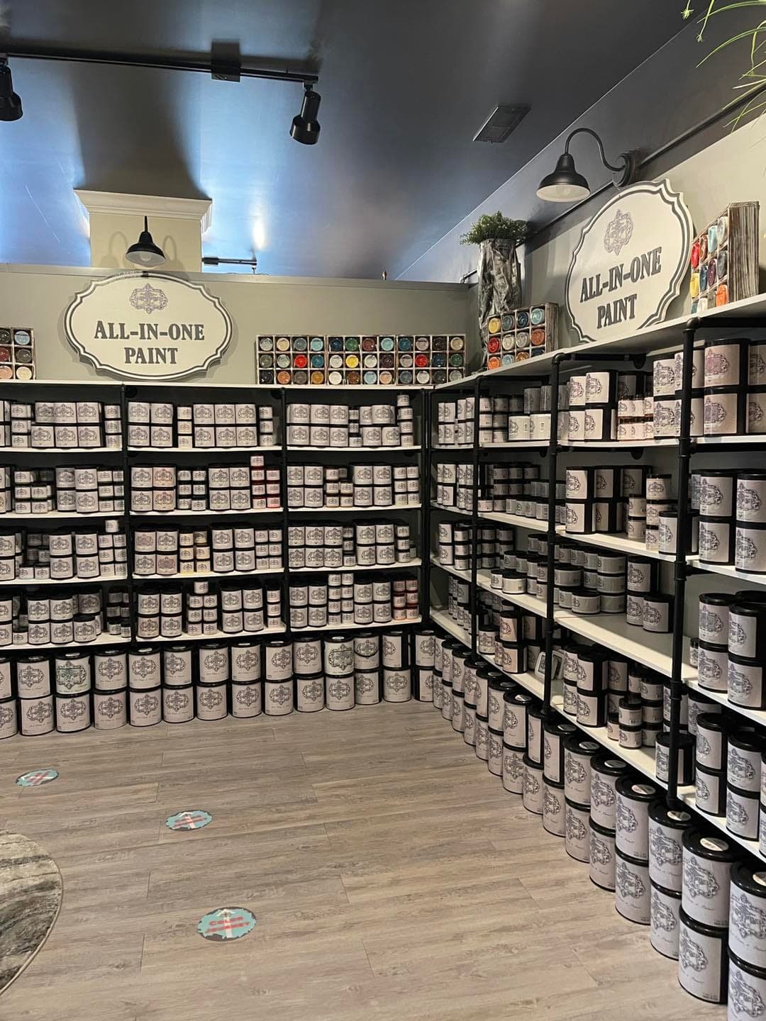 Shelves of ALL-IN-ONE Paint jars inside the Heirloom Traditions Company Store